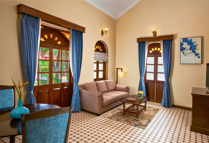 Spacious living area of the Maharaja Suite at Mercure Devaaya, Divar Island Goa