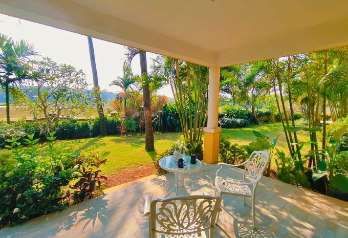 Shaded villa veranda overlooking tropical gardens and river at Mercure Goa Devaaya Resort Divar Island